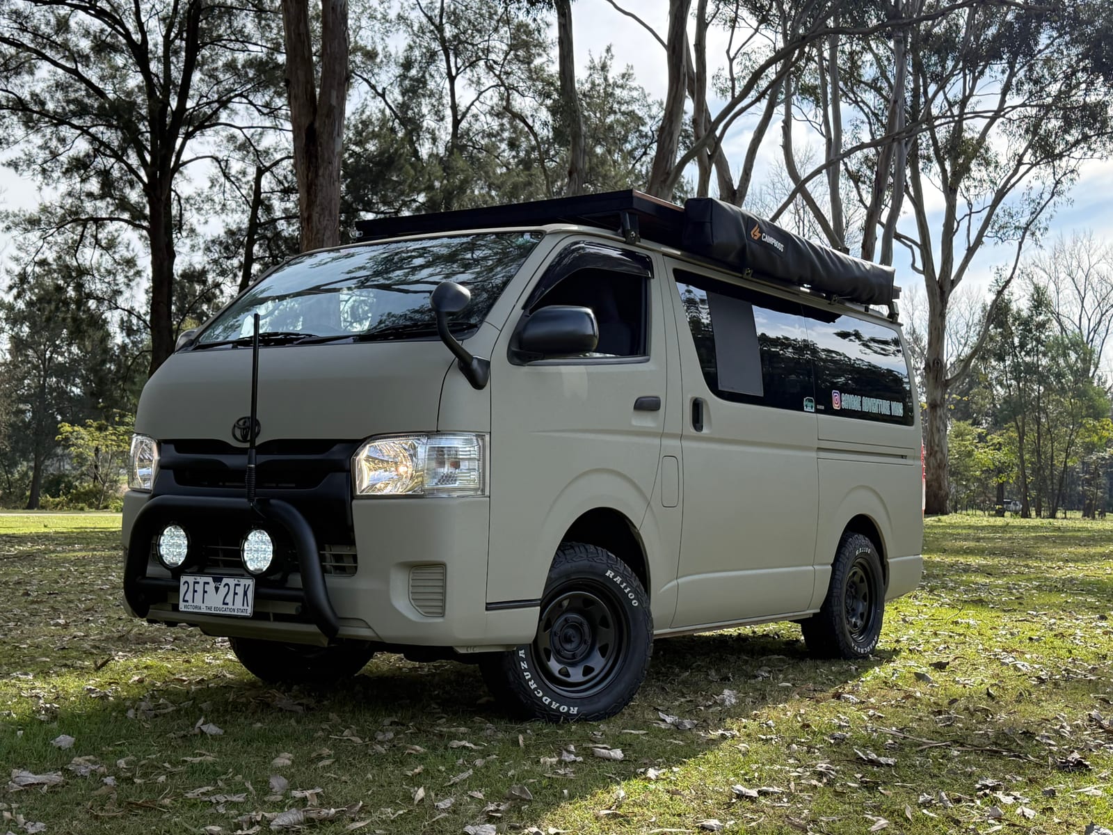 Khaki 4×4 Hiace — Rooftop tent folded down on the rack