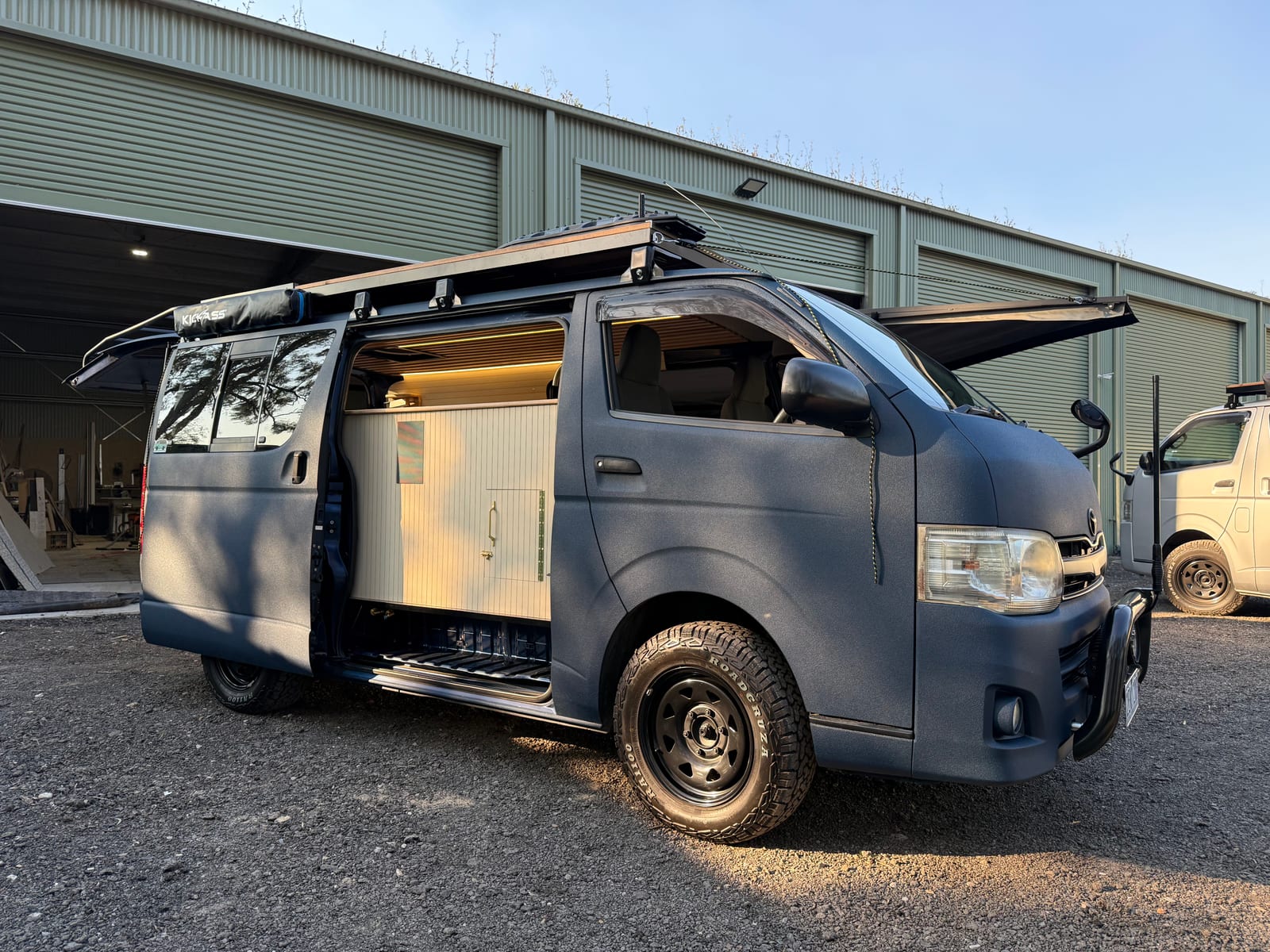 Navy 4&times;4 Hiace &mdash; Front three-quarter at the workshop