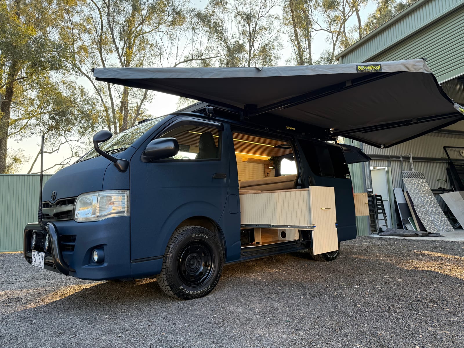 Navy 4×4 Hiace — Nose on under the awning